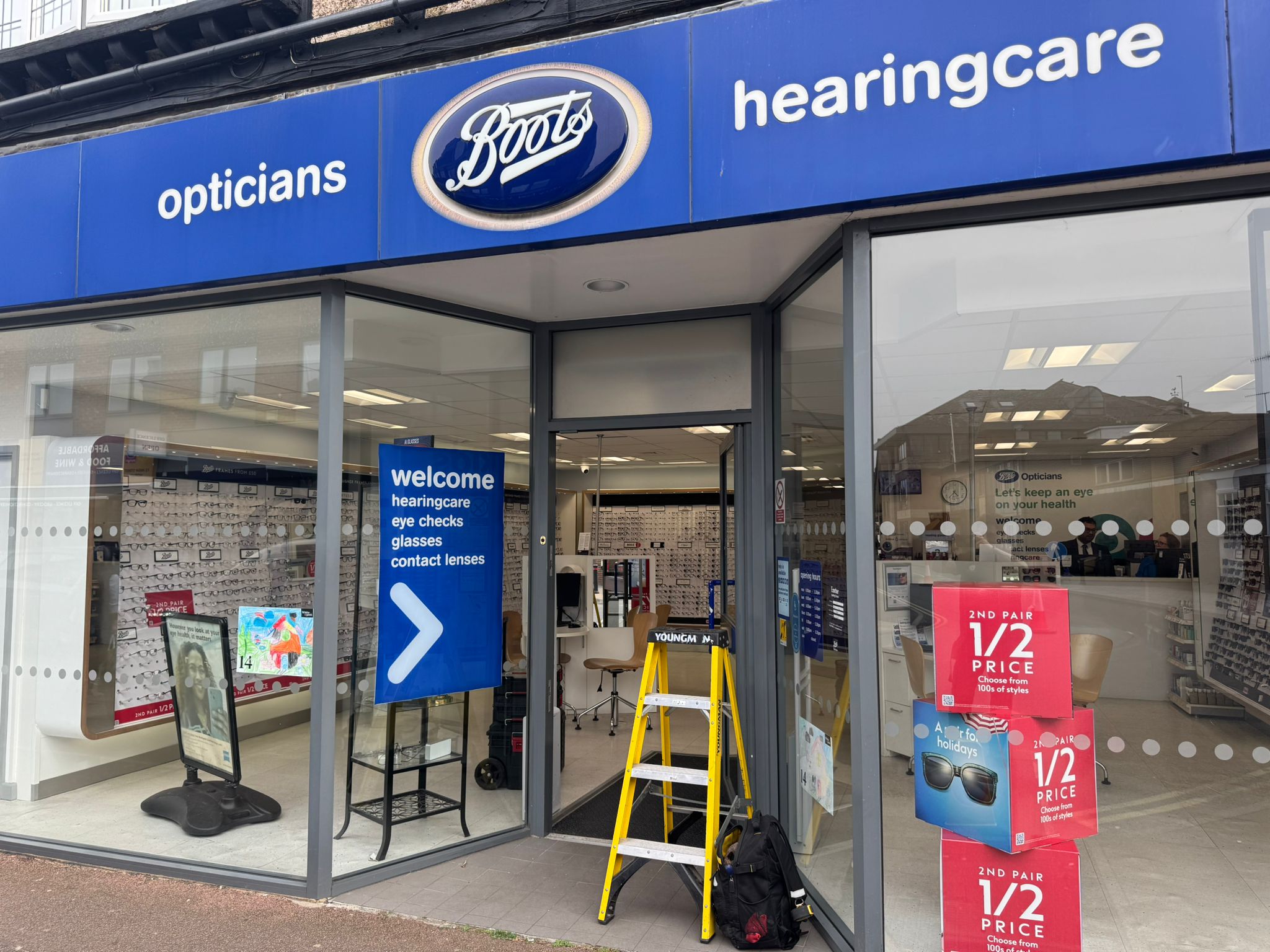 Commercial entrance door repair at Boots Opticians, Horley, Surrey