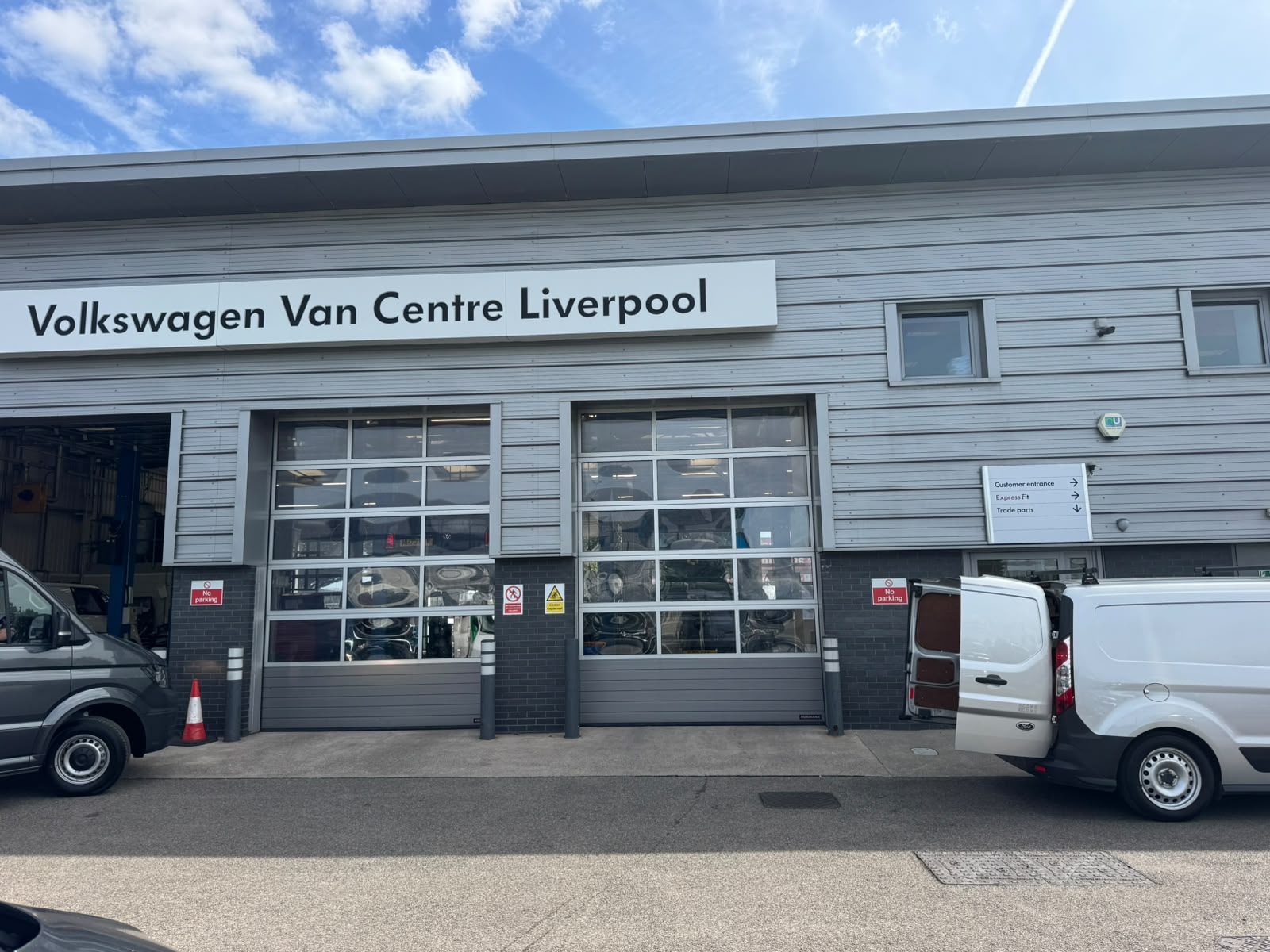Volkswagen Van Centre Liverpool in Speke — workshop doors and customer entrance where CDMS replaced the transom closer