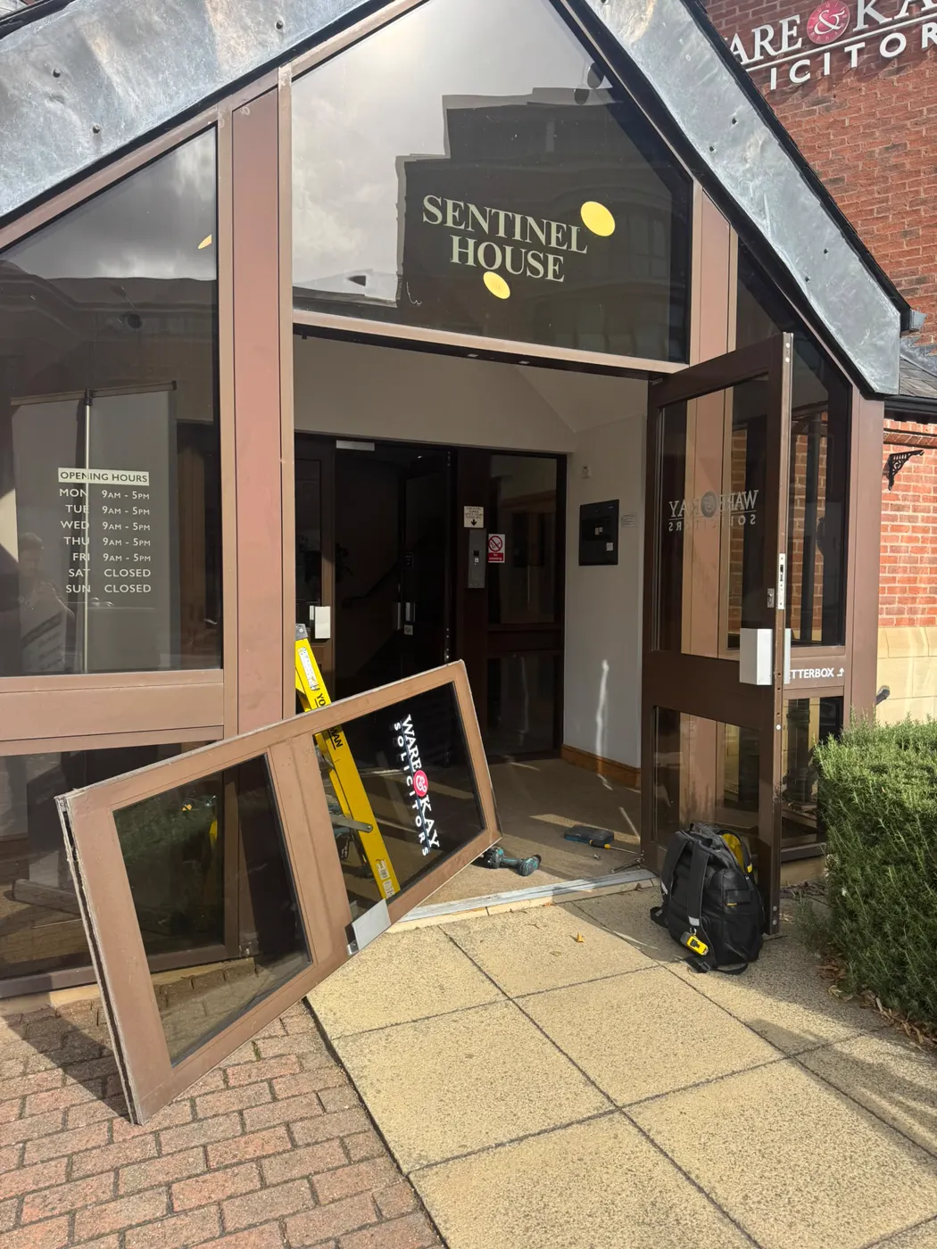 Sentinel House entrance at Ware & Kay Solicitors York with one aluminium door leaf lifted out for transom closer replacement