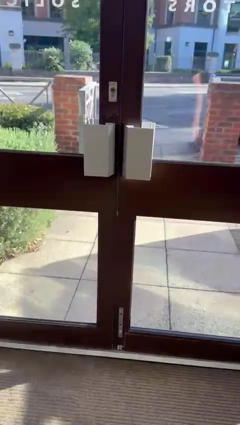 Double bronze aluminium entrance doors at Sentinel House, Ware & Kay Solicitors York, seen from inside with the flush shoot bolt in the secondary leaf